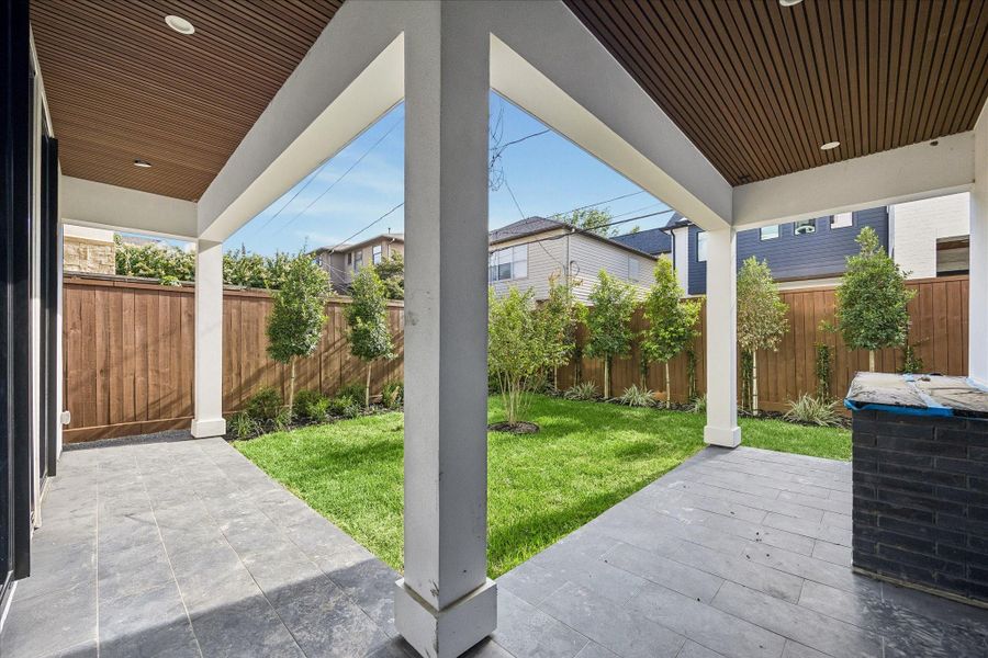 Backyard with covered patio. Backyard with covered patio.