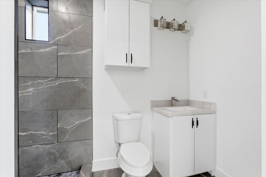 The primary bath offers plenty of storage, and a spacious stand up shower. The primary bath offers plenty of storage, and a spacious stand up shower.