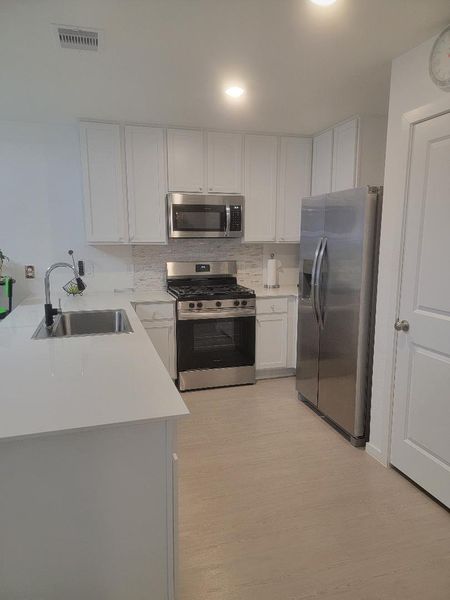Kitchen with stainless steel frigidaire appliances. Kitchen with stainless steel frigidaire appliances.