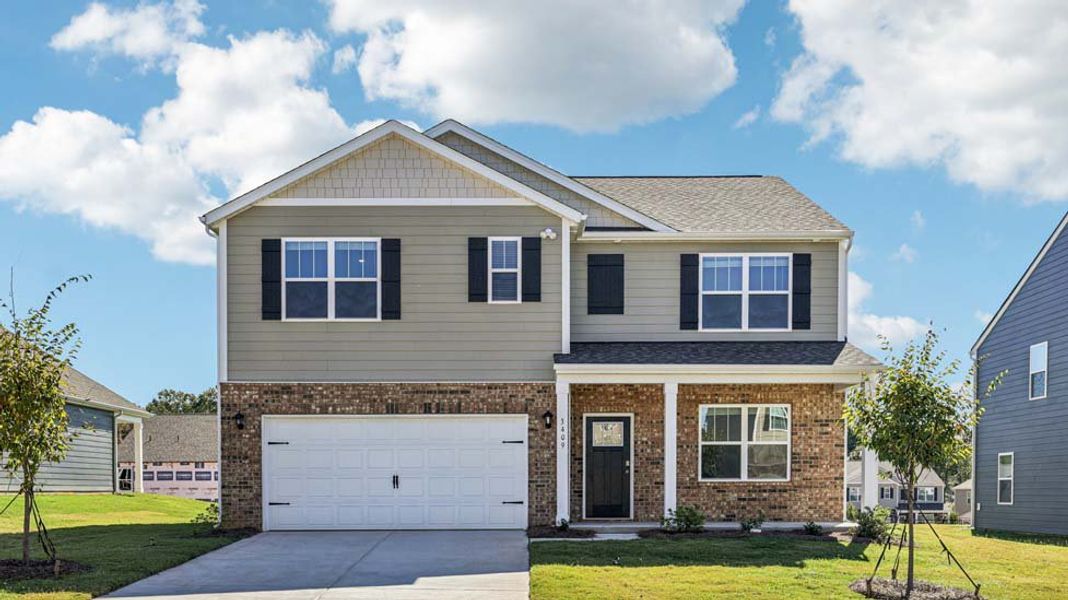 Front exterior of a new home in The Hamptons at Hickory, Hickory, NC, highlighting curb appeal (Image 1). Front exterior of a new home in The Hamptons at Hickory, Hickory, NC, highlighting curb appeal (Image 1).