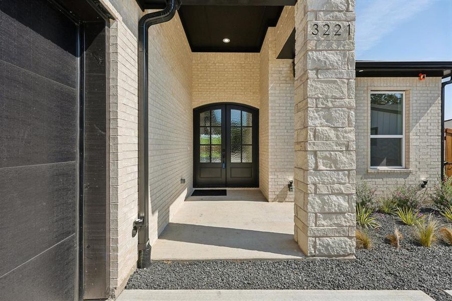 Doorway to property featuring french doors