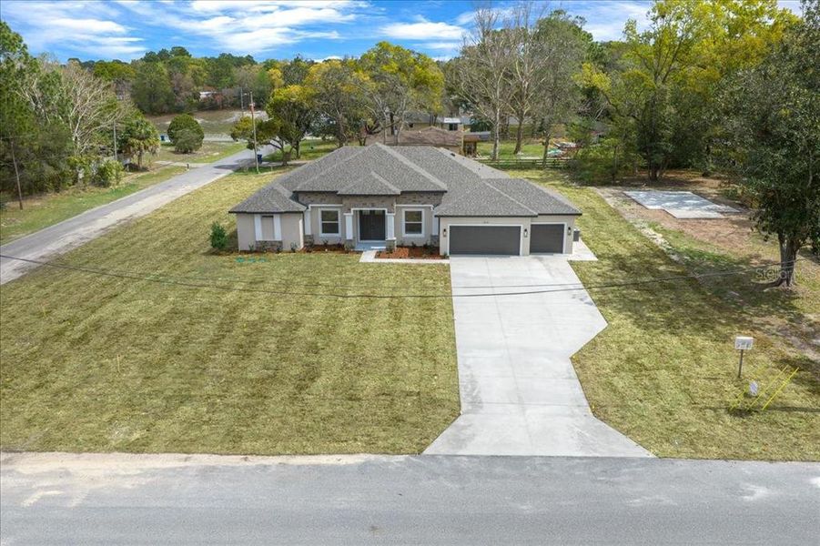 Front exterior of a new home in , Spring Hill, FL, highlighting curb appeal (Image 1). Front exterior of a new home in , Spring Hill, FL, highlighting curb appeal (Image 1).