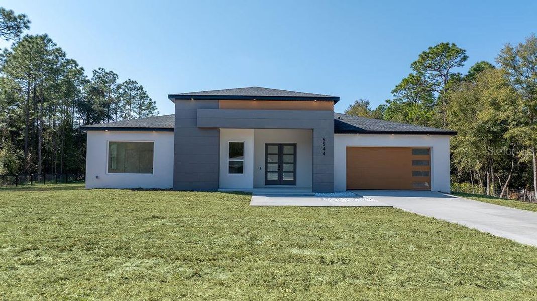 Front exterior of a new home in , Ocala, FL, highlighting curb appeal (Image 25).