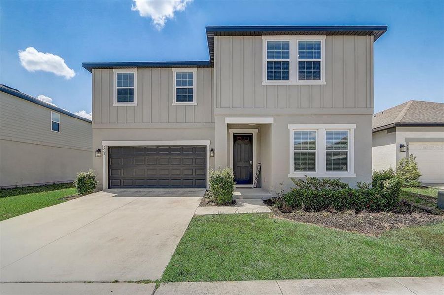 Front exterior of a new home in Glen at West Haven, Davenport, FL, highlighting curb appeal (Image 25).