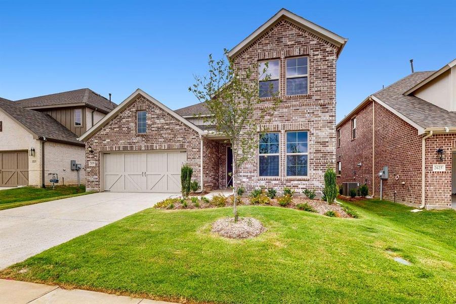 Front exterior of a new home in Lilybrooke at Legacy Hills, Celina, TX, highlighting curb appeal (Image 17).