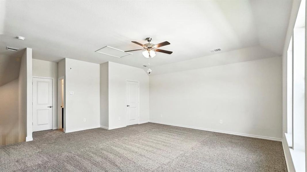 Unfurnished bedroom featuring carpet and a ceiling fan