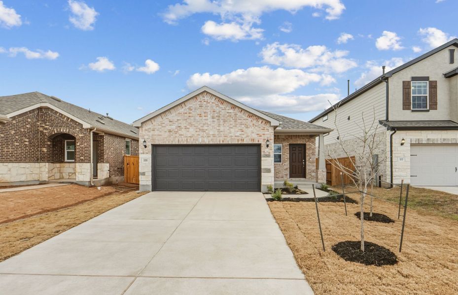 Front exterior of a new home in Crosswinds, Kyle, TX, highlighting curb appeal (Image 19).