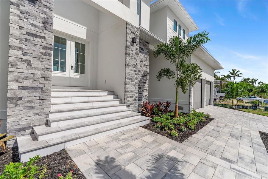 Front exterior of a new home in , Longboat Key, FL, highlighting curb appeal (Image 28). Front exterior of a new home in , Longboat Key, FL, highlighting curb appeal (Image 28).