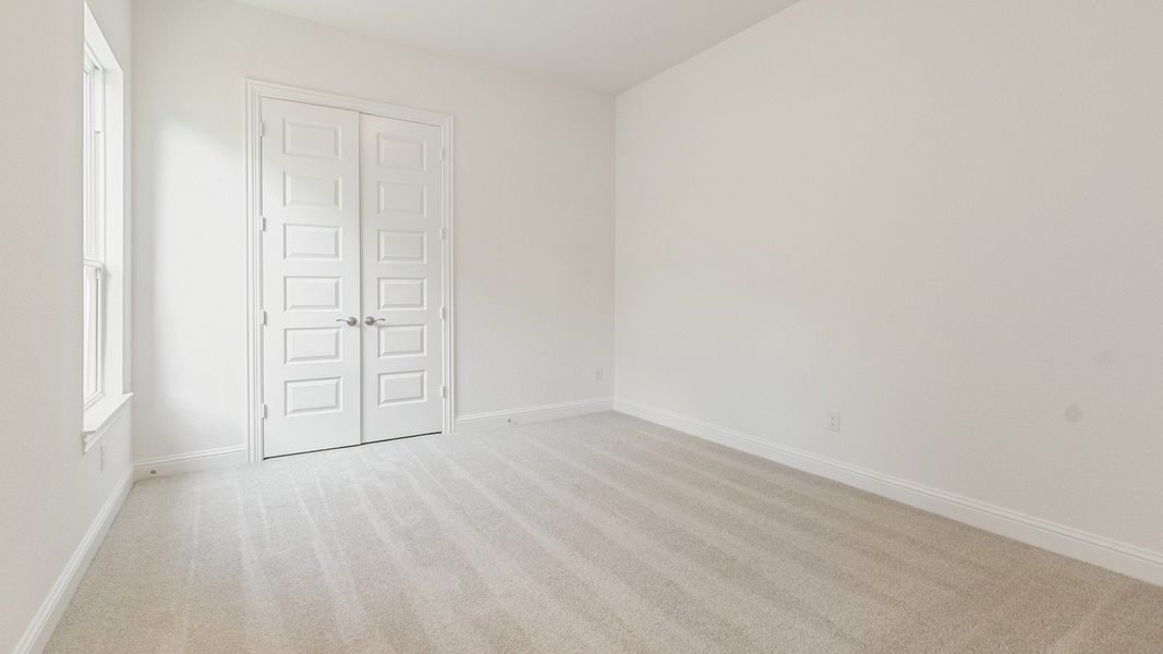 Representative furnished interior of a home built from the Vanderbilt by DRB Homes in Creekhaven, Iowa Colony (Image 15).