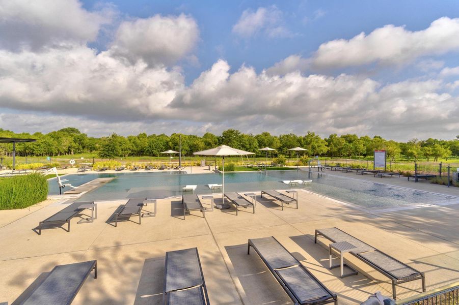 Resort-style pool deck at The Union featuring shallow splash zones, lap lanes, and umbrella-shaded loungers. Resort-style pool deck at The Union featuring shallow splash zones, lap lanes, and umbrella-shaded loungers.