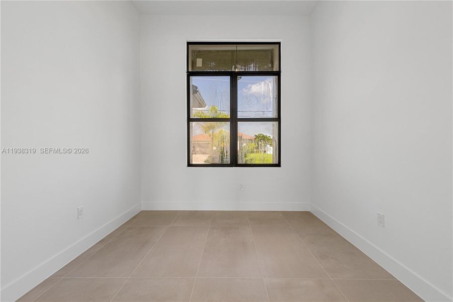 A versatile den provides flexible space ideal for a home office, study, or flex room to suit a variety of needs.