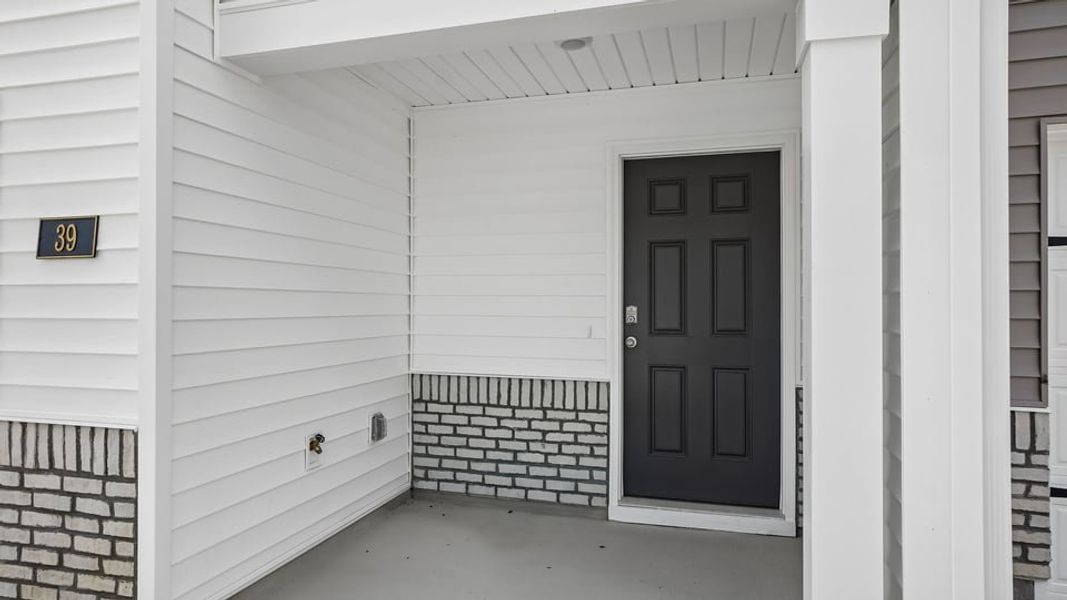 Exterior details and patio area of a home in The Townes at Honeycutt Oaks, Angier (Image 3).