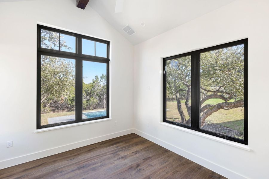 Downstairs guest suite that overlooks pool and backyard