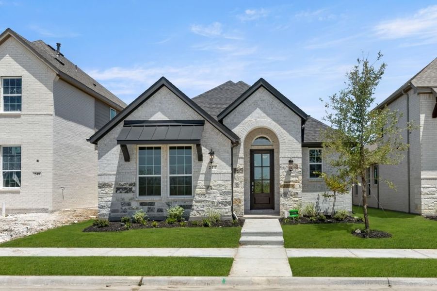Representative exterior photo of a completed home built from the Cypress by UnionMain Homes in Edgewater, Fate, TX (Image 2). Representative exterior photo of a completed home built from the Cypress by UnionMain Homes in Edgewater, Fate, TX (Image 2).