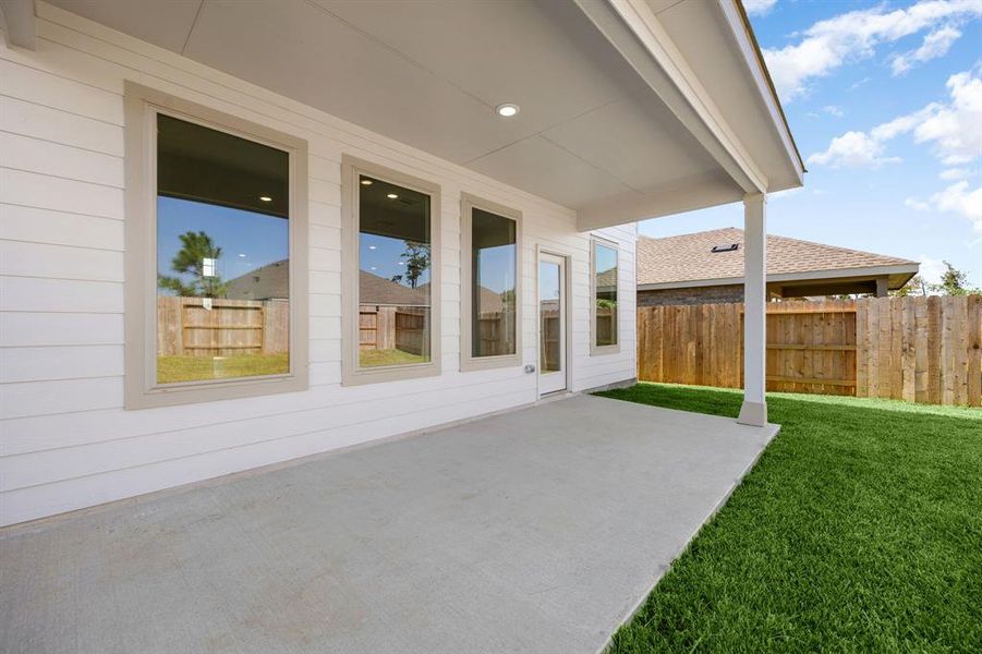 Expansive covered patio and spacious backyard, perfect for all outdoor activities