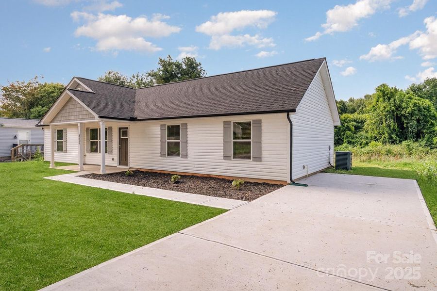 Front exterior of a new home in , Cherryville, NC, highlighting curb appeal (Image 1).