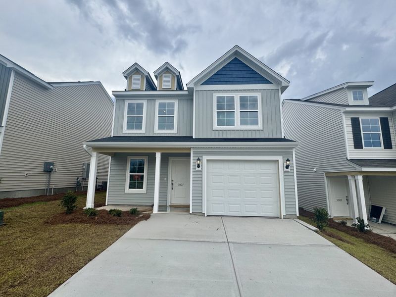 Front exterior of a new home in Ellington, Elgin, SC, highlighting curb appeal (Image 1). Front exterior of a new home in Ellington, Elgin, SC, highlighting curb appeal (Image 1).