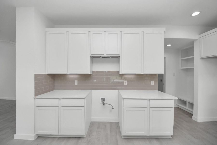 This generously spacious kitchen is a dream realized! Sample photo of completed home with similar floor plan. Actual colors and selections may vary. This generously spacious kitchen is a dream realized! Sample photo of completed home with similar floor plan. Actual colors and selections may vary.
