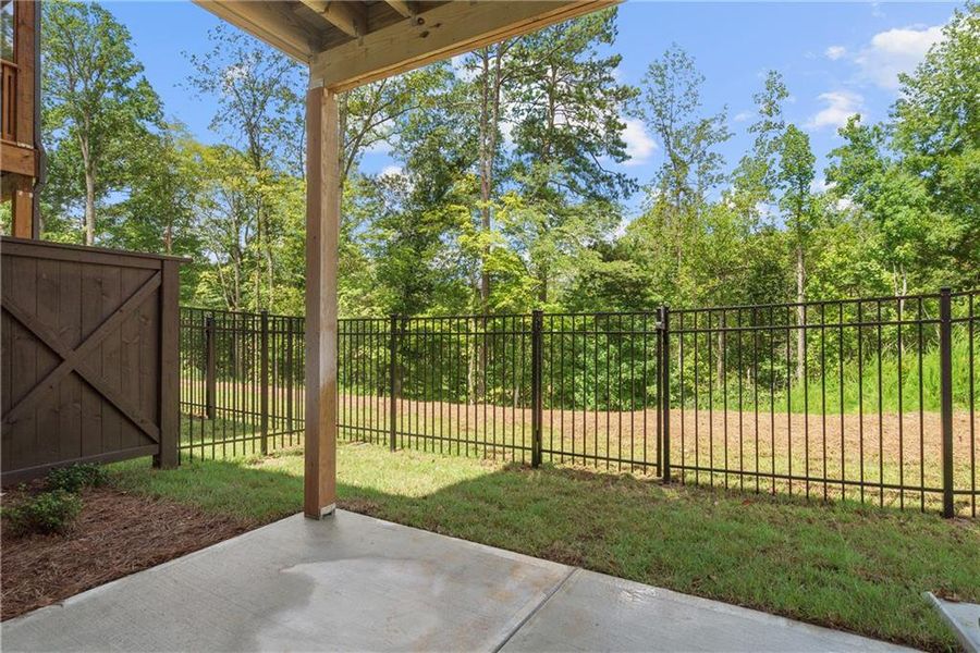 Exterior details and patio area of a home in Waterside Townhomes, Peachtree Corners (Image 2).