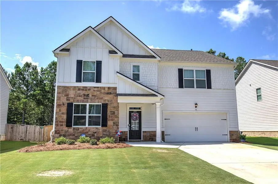 Front exterior of a new home in , Cartersville, GA, highlighting curb appeal (Image 1). Front exterior of a new home in , Cartersville, GA, highlighting curb appeal (Image 1).