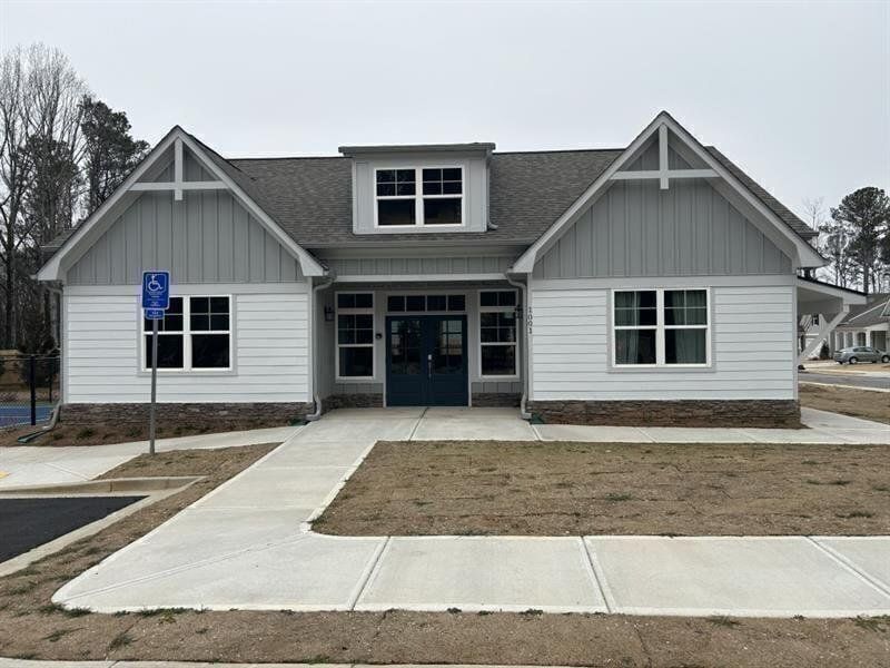 Front exterior of a new home in Cooks Farm, Woodstock, GA, highlighting curb appeal (Image 41).