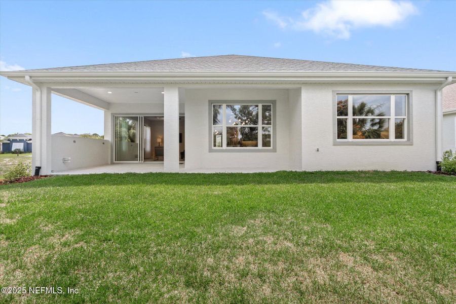 Front exterior of a new home in , Palm Coast, FL, highlighting curb appeal (Image 26). Front exterior of a new home in , Palm Coast, FL, highlighting curb appeal (Image 26).