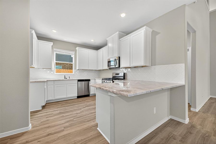 Furnished interior view inside a new home in Sunterra, Katy (Image 7).