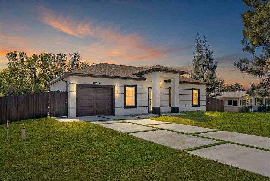 Front exterior of a new home in , Punta Gorda, FL, highlighting curb appeal (Image 24).