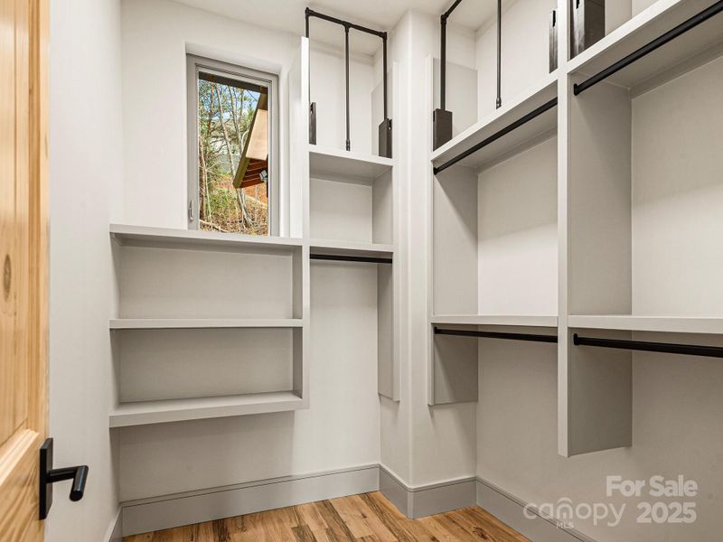 Primary Suite closet with easy access pull down system
