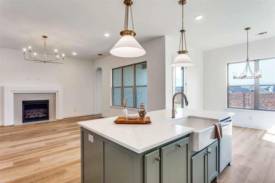 Kitchen featuring a chandelier, hanging light fixtures, plenty of natural light, and recessed lighting Kitchen featuring a chandelier, hanging light fixtures, plenty of natural light, and recessed lighting