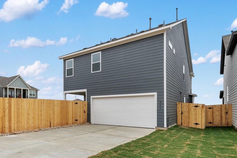 Exterior details and patio area of a home in The Cottages at Lariat, Liberty Hill (Image 31).