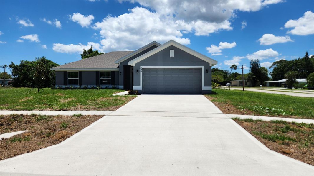 Front exterior of a new home in Gatlin, Port St. Lucie, FL, highlighting curb appeal (Image 21). Front exterior of a new home in Gatlin, Port St. Lucie, FL, highlighting curb appeal (Image 21).