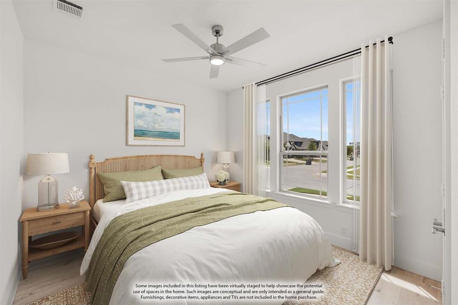Bedroom with ceiling fan, large windows, hardwood floors, and wood-framed bed with neutral bedding
