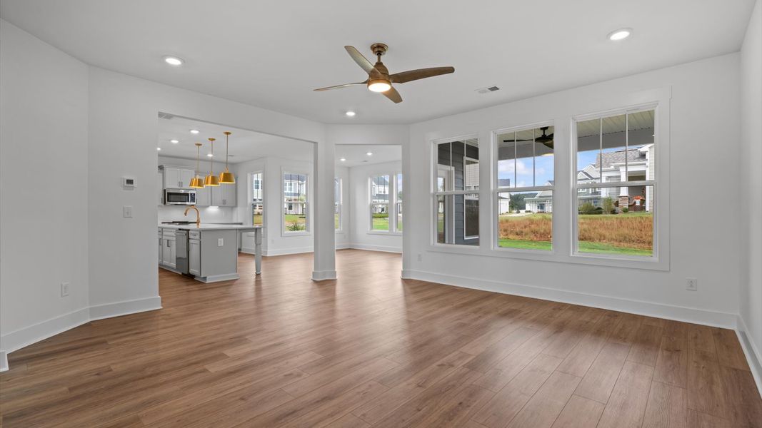 Vibrant and welcoming family room anchored by clean lines, tasteful materials, and abundant light
