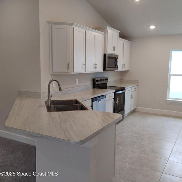 Furnished interior view inside a new home in St. John Preserve, Palm Bay (Image 4).