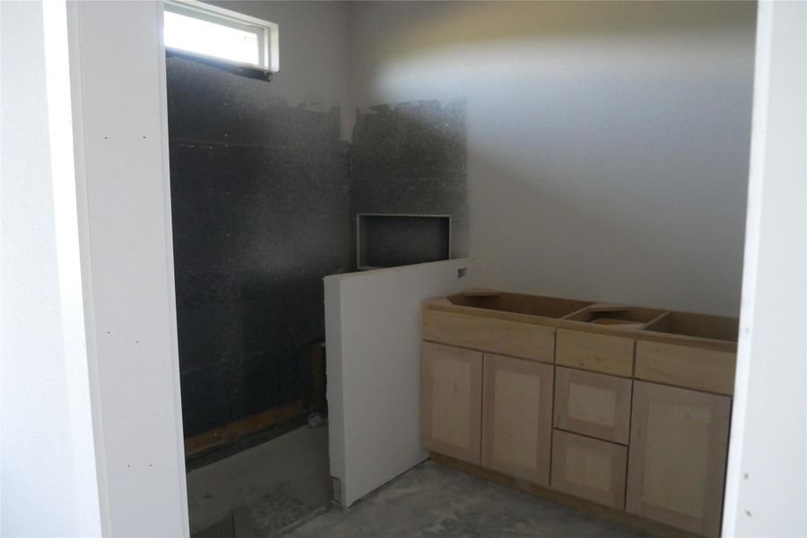 Spacious en suite bathroom layout with dual vanities and a frameless shower. Spacious en suite bathroom layout with dual vanities and a frameless shower.