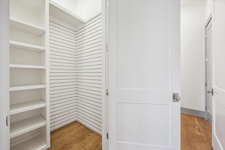 Elevator Ready closet downstairs. Currently installed with custom built ins and organizational wall. Tucked back hall from Kitchen. Elevator Ready closet downstairs. Currently installed with custom built ins and organizational wall. Tucked back hall from Kitchen.