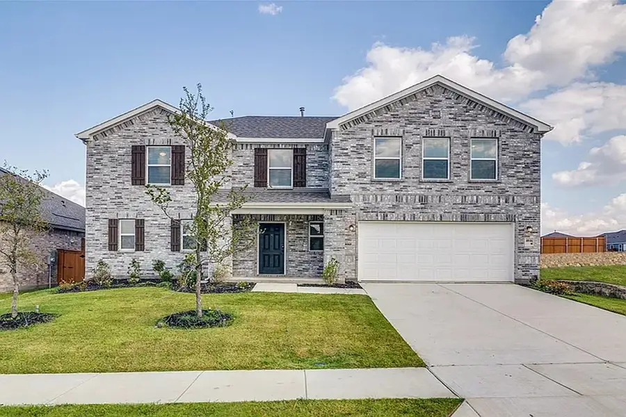 Front exterior of a new home in Heartland Signature, Crandall, TX, highlighting curb appeal (Image 1). Front exterior of a new home in Heartland Signature, Crandall, TX, highlighting curb appeal (Image 1).