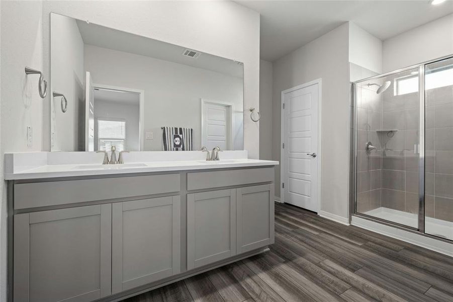 Master Bath with Dual Sinks, Linen Closet and Large Walk-in Shower.