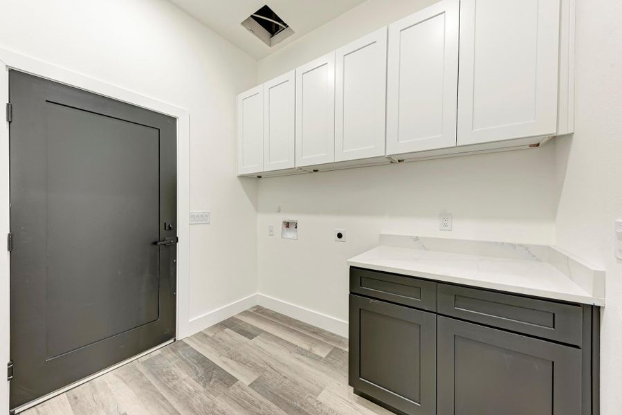 Laundry room in guest apartment