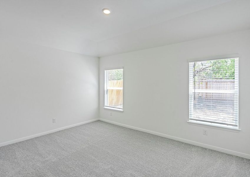 Master bedroom with two windows facing the backyard Master bedroom with two windows facing the backyard