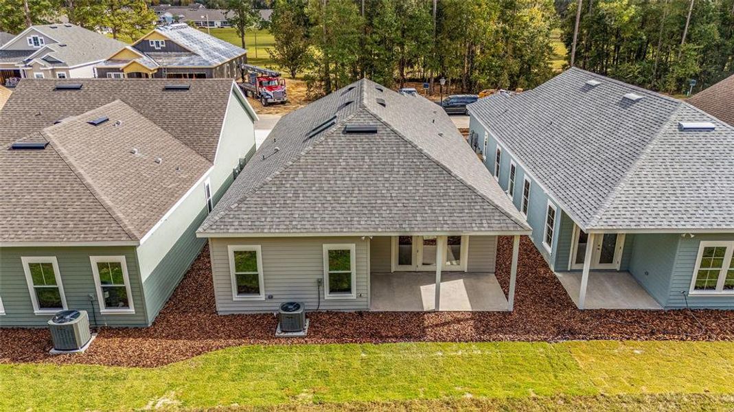 Front exterior of a new home in Fairway Pointe at West End, Newberry, FL, highlighting curb appeal (Image 30).