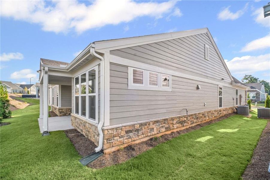 Front exterior of a new home in Laurel Farms, Dallas, GA, highlighting curb appeal (Image 26). Front exterior of a new home in Laurel Farms, Dallas, GA, highlighting curb appeal (Image 26).