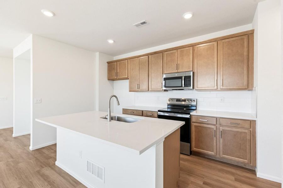 Furnished interior view inside a new home in Sky Ranch Villas, Watkins (Image 7).