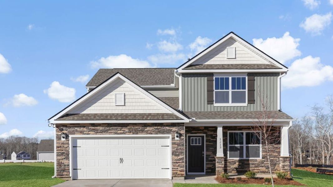 Front exterior of a new home in Woodglen, Piedmont, SC, highlighting curb appeal (Image 1). Front exterior of a new home in Woodglen, Piedmont, SC, highlighting curb appeal (Image 1).