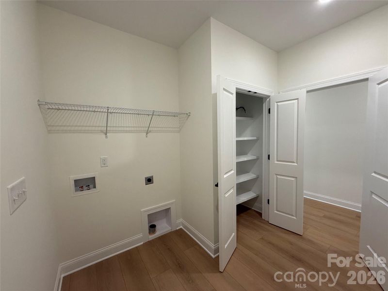 Additional storage closet with built-in shelving