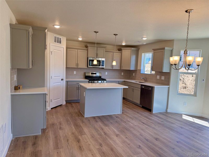 Furnished interior view inside a new home in Sky Ranch - Highland Collection, Watkins (Image 1).