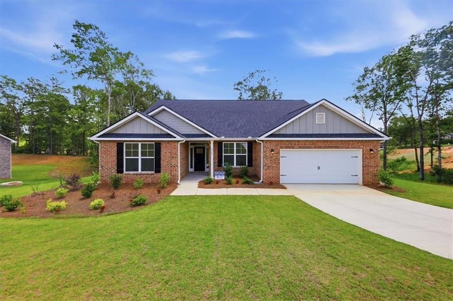 Front exterior of a new home in Tuscany Hills, Douglasville, GA, highlighting curb appeal (Image 25).