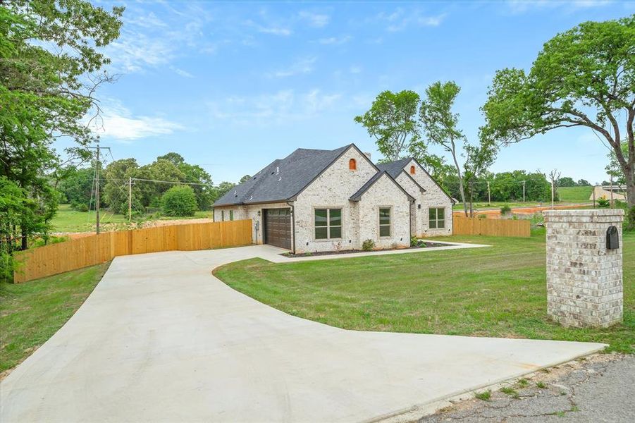 Front exterior of a new home in , Lindale, TX, highlighting curb appeal (Image 25).