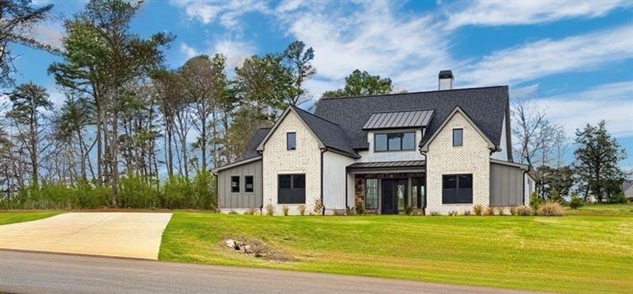 Front exterior of a new home in , Rydal, GA, highlighting curb appeal (Image 28). Front exterior of a new home in , Rydal, GA, highlighting curb appeal (Image 28).
